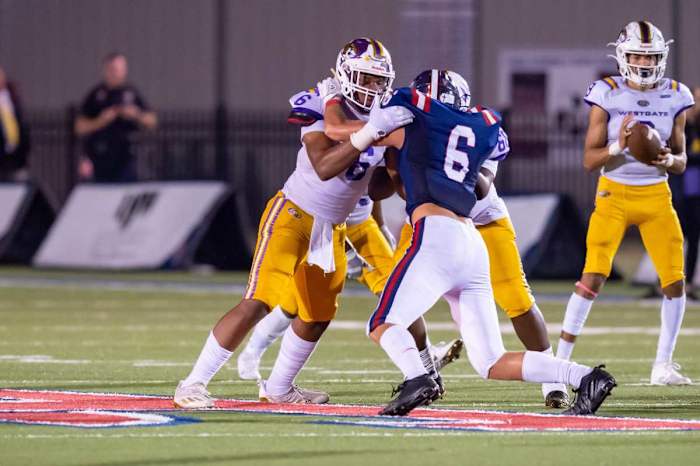 Tight end Danny Lewis blocking as Westgate takes on Teurlings Catholic.
